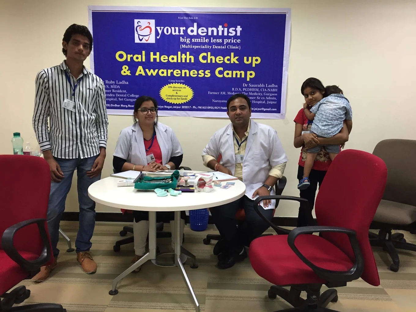 Oral health check-up and awareness camp with a dental team and visitors