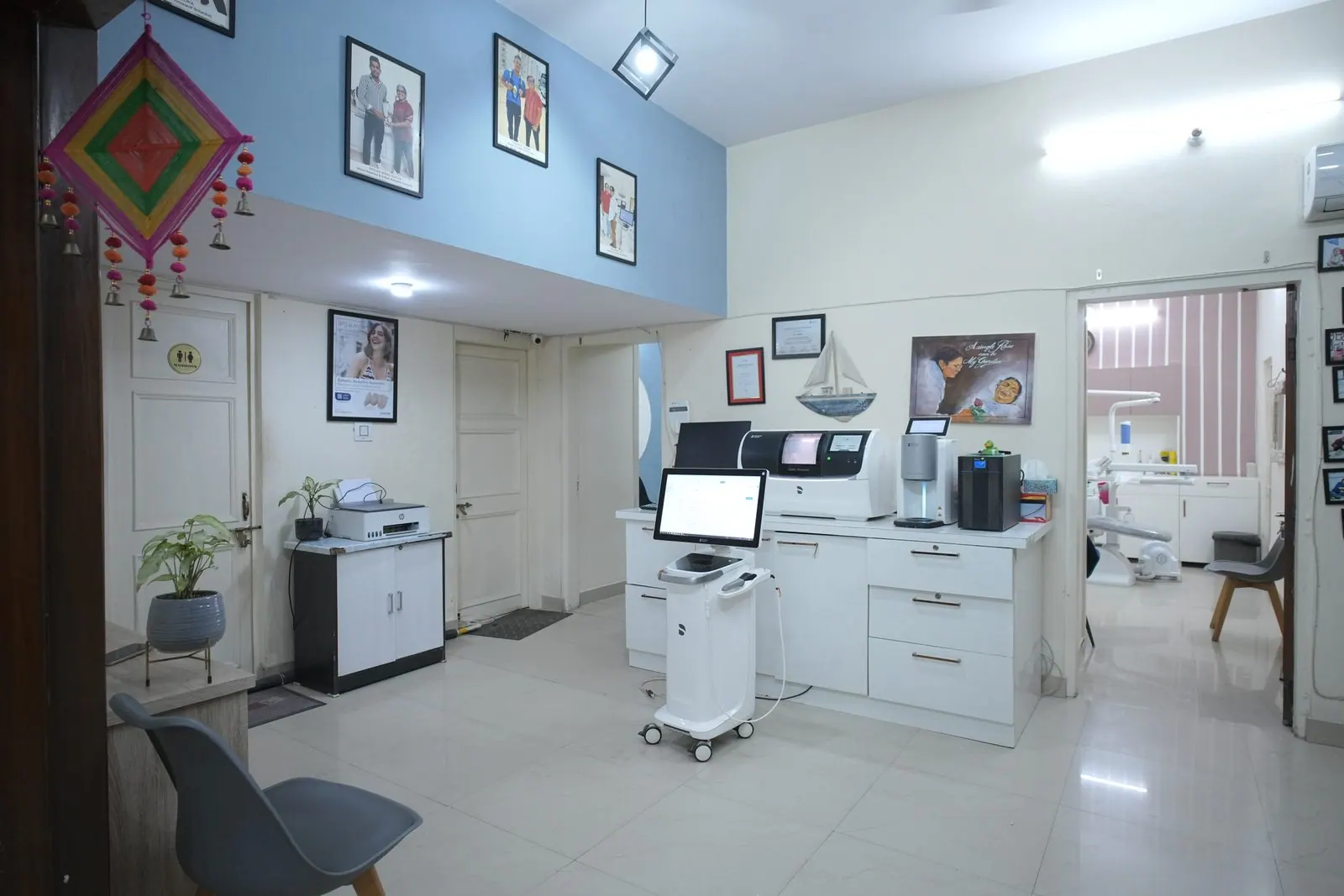 Waiting area with a digital scanner and computer workstation at Your Dentist, Malviya Nagar, Jaipur