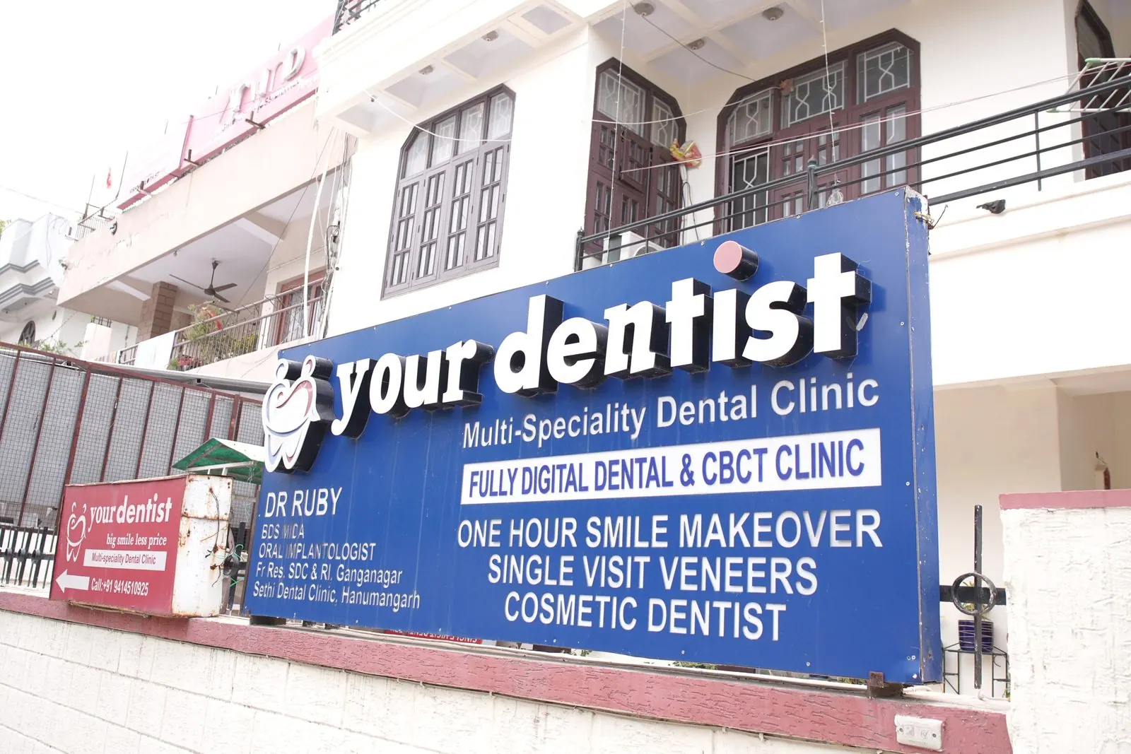 Your Dentist clinic signboard on the building front in Malviya Nagar, Jaipur