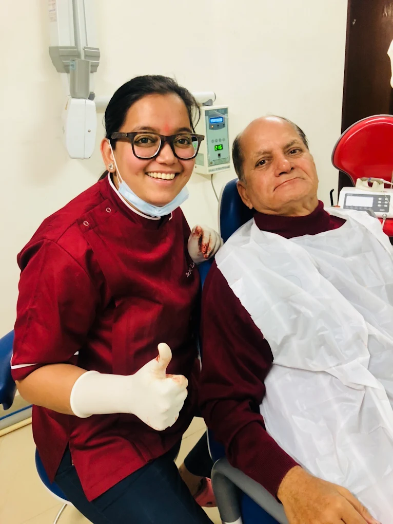 Patient and dentist smiling together in the treatment room at Your Dentist, Malviya Nagar, Jaipur