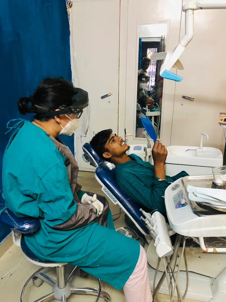 Dentist treating a patient in the dental chair at Your Dentist, Malviya Nagar, Jaipur